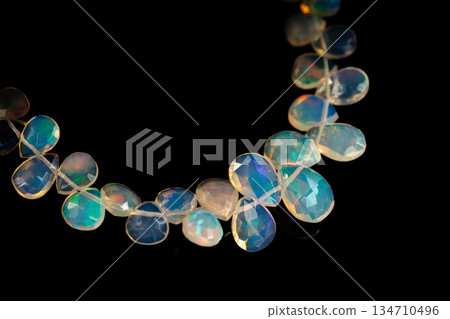 Ethiopian Opal Drop Cut Play of Color Natural Stone Black Background Material 134710496
