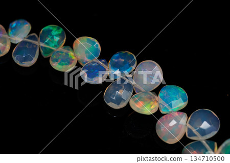 Ethiopian Opal Drop Cut Play of Color Natural Stone Black Background Material Ethiopian Opal Drop Cut Play of Color Natural Stone Black Background Material 134710500