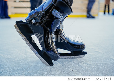 Close Up of Ice Skates on Ice Close Up of Ice Skates on Ice 134711341