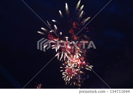 bright fireworks high in the dark sky bright fireworks high in the dark sky 134711694