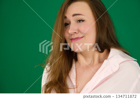 Photo of nervous unsure lady wear green shirt biting lip isolated pink color background 134711872