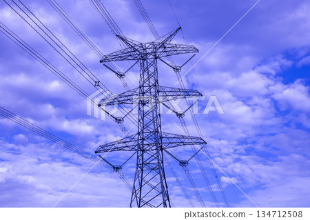 A large Transmission Tower set against a blue sky A large Transmission Tower set against a blue sky 134712508