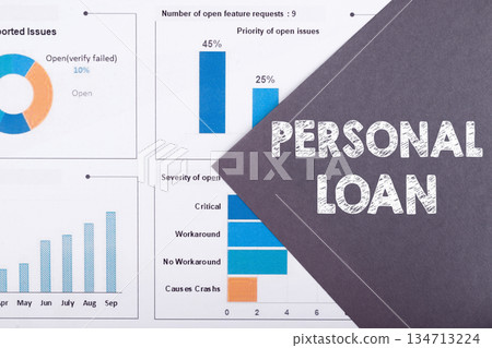 PERSONAL LOAN text on gray paper on chart PERSONAL LOAN text on gray paper on chart 134713224
