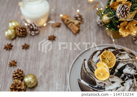 Christmas fruit cake on wooden table with festive decorations 134713234
