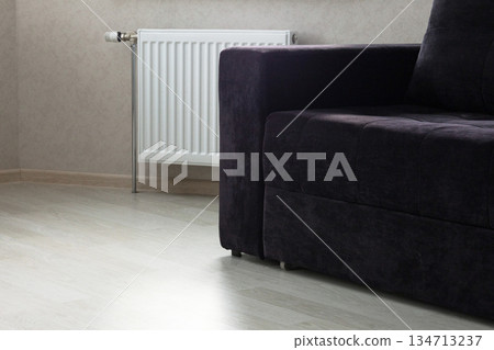 Modern radiator at home. Central heating system Modern radiator at home. Central heating system 134713237