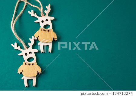 Christmas composition with deers. New Year background for presentation of work or text. Beautiful greeting card. Copy space. Top view Christmas composition with deers. New Year background for presentation of work or text. Beautiful greeting card. Copy space. Top view 134713274