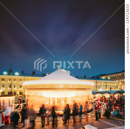 Helsinki, Finland. Xmas Market On Senate Square With Holiday Carousel And Famous Landmark Is Lutheran Cathedral In Winter Night Helsinki, Finland. Xmas Market On Senate Square With Holiday Carousel And Famous Landmark Is Lutheran Cathedral In Winter Night 134713833