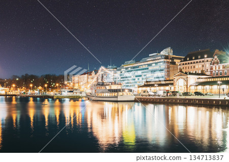 Helsinki, Finland. Night View Of Etelaranta Street. Vanha Kauppahalli, Old Market Hall. Night stars shining above street Helsinki, Finland. Night View Of Etelaranta Street. Vanha Kauppahalli, Old Market Hall. Night stars shining above street 134713837