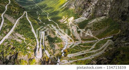 Trollstigen, Andalsnes, Norway. Cars Goes On Serpentine Mountain Road Trollstigen. Famous Norwegian Landmark And Popular Destination. Norwegian County Road 63 In Summer Day. 4K 134713839