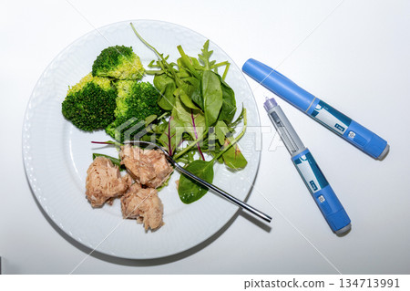 Medical diet concept featuring tuna salad broccoli and Ozempic Medical diet concept featuring tuna salad broccoli and Ozempic 134713991