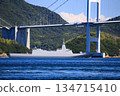 A destroyer passing through the Kurushima Kaikyo Bridge 134715410