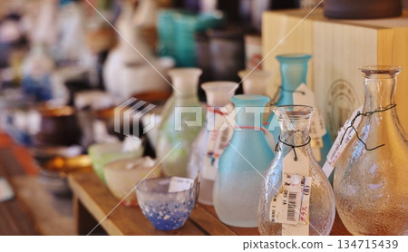 Glass sake bottles displayed inside a shop in Kappabashi Tool Street 134715439