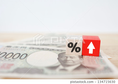 Concept of 10,000 yen bill with blocks showing interest rate rise or percentage increase. Concept of 10,000 yen bill with blocks showing interest rate rise or percentage increase. 134715630