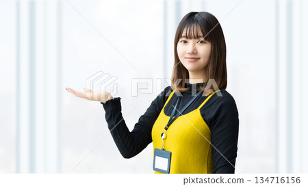 Woman/businesswoman giving directions by hand 134716156
