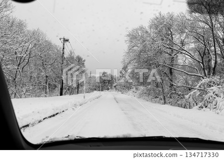 Driving on a snowy road - View from the passenger seat - a-3 monochrome Driving on a snowy road - View from the passenger seat - a-3 monochrome 134717330