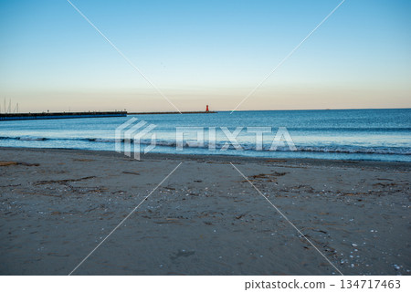 The sea seen from the shore at dusk The sea seen from the shore at dusk 134717463
