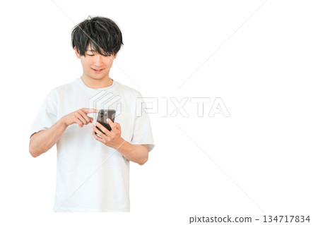 Young Asian man using a smartphone (smartphone work, search, research) 134717834