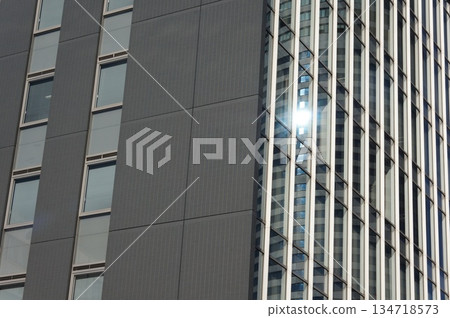 sunset reflected in the window of a building 134718573