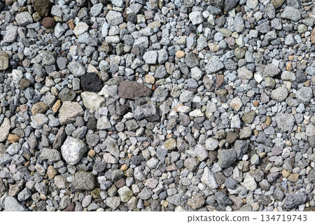 High angle shot of a large pile of small gravel stones in a variety of colors. Gravel is small and round. Gravel stone abstract texture background 134719743