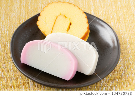 Datemaki and red and white kamaboko on a plate Datemaki and red and white kamaboko on a plate 134720788