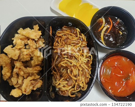 A classic Korean-Chinese combo of jajangmyeon with thick, chewy noodles coated in rich black bean sauce, served alongside crispy tangsuyuk, deep-fried pork with sweet and sour sauce. A classic Korean-Chinese combo of jajangmyeon with thick, chewy noodles coated in rich black bean sauce, served alongside crispy tangsuyuk, deep-fried pork with sweet and sour sauce. 134722190