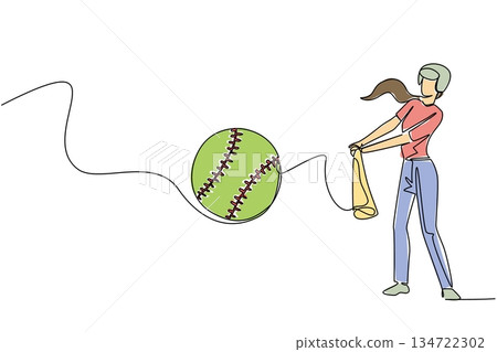 Female softball batter in a helmet, red shirt and jeans swings at green softball with bat, showing determination and inclusive energy in World Softball Day games. Continuous line drawing sport concept 134722302
