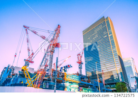 New landscape of Tokyo cityscape in Japan. TOKYO TORCH Tokiwabashi redevelopment - Cranes in Otemachi! Huge steel structure 134722575