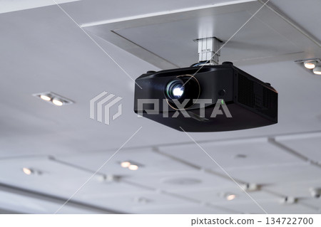 ceiling projector in conference room for presentation 134722700