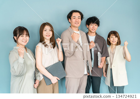 Male and female businessmen in company offices, office casual (fist pump, motivation, expectation, success) Male and female businessmen in company offices, office casual (fist pump, motivation, expectation, success) 134724921