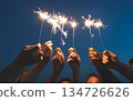 people holding sparkler on the background of the night 134726626