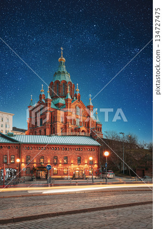 Helsinki, Finland. Uspenski Cathedral In Evening Illuminations Lights. Eastern Orthodox Cathedral Dedicated To Dormition Of The Theotokos - Virgin Mary. Night stars shining above street 134727475