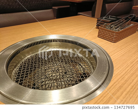 Yakiniku restaurant tongs and grill image Yakiniku restaurant tongs and grill image 134727695
