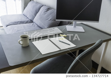 Home working desk and coffee, copy space on monitor Home working desk and coffee, copy space on monitor 134727714
