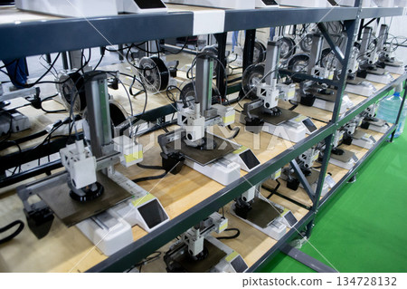 Many 3D printers printing object. 3D printers printing model from molten plastic. 3D printers creating shape from molten plastic flowing out of extruder. New modern 3D Printing additive technologies 134728132