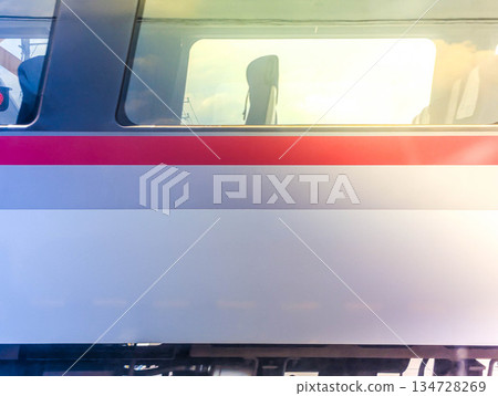 A train passing in front of me 134728269