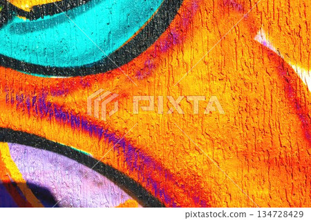 Abstract Graffiti Wall with Bright Orange, Purple, Turquoise Curves in Urban Street Art Style 134728429