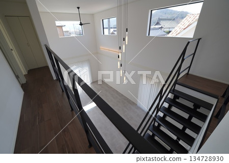 A house with a spacious atrium and stairs A house with a spacious atrium and stairs 134728930