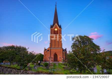 Brick Church and Cemetery at Sunset in Lillehammer, Norway 134729007