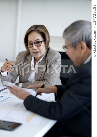 Business people in a team meeting work professionally at the office Business people in a team meeting work professionally at the office 134729185