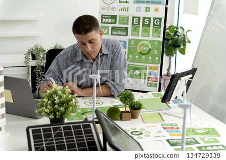 Businessman is planning for esg environmental social corporate governance projects Businessman is planning for esg environmental social corporate governance projects 134729339