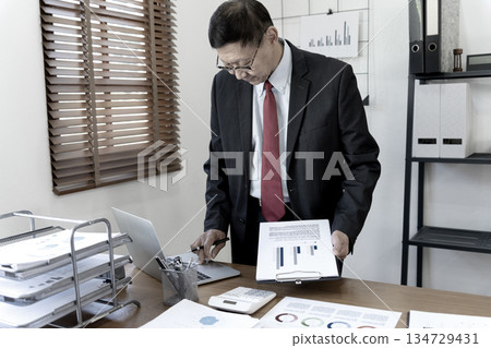 close up image of manager on desk, executive marketing analyst 134729431