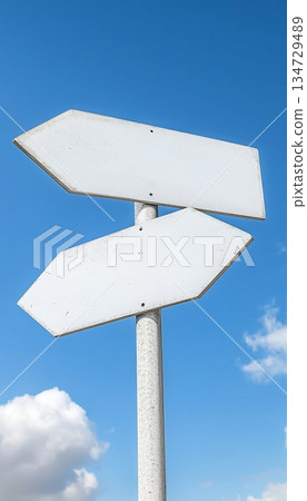 White black board sign arrow for traffic guide information  or place, with blue sky background 134729489