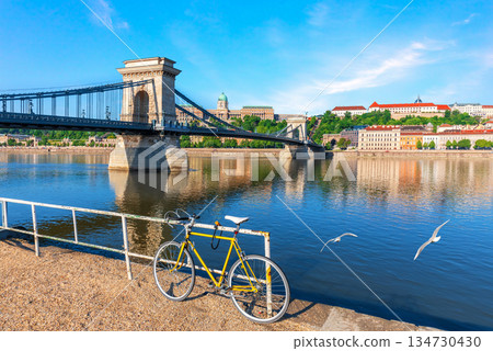 Lonely bicycle standing on the Danube River bank near Chain Bridge and Buda castle, Budapest, Hungary Lonely bicycle standing on the Danube River bank near Chain Bridge and Buda castle, Budapest, Hungary 134730430
