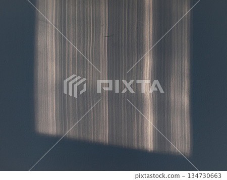 The sun's rays on the white uneven wall The sun's rays on the white uneven wall 134730663