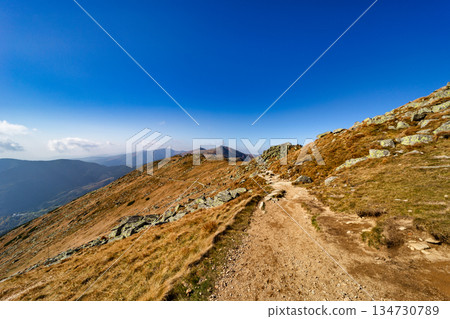 Autumn hiking trail on the ridge of Low Tatras mountains, Slovakia. Autumn hiking trail on the ridge of Low Tatras mountains, Slovakia. 134730789