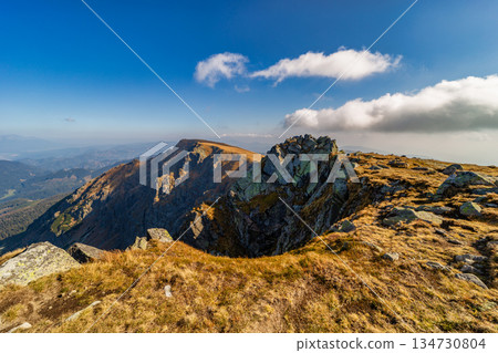 Autumn hiking trail on the ridge of Low Tatras mountains, Slovakia. Autumn hiking trail on the ridge of Low Tatras mountains, Slovakia. 134730804