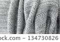 Soft gray knitted wool fabric texture background with detailed yarn pattern 134730826