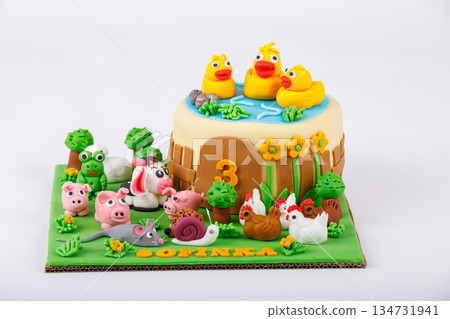 Figurine farm cake for a third birthday. 134731941