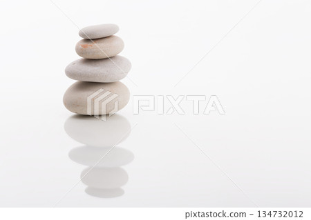 Zen Stones Stacked in Balance on White Background Zen Stones Stacked in Balance on White Background 134732012
