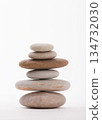 Zen Stack of Smooth Stones Against White Background 134732030